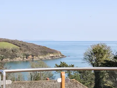 a view of the ocean from a balcony at Dovefields in Helston