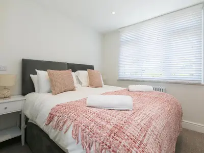 a bedroom with a bed with two towels on it at 6 Albany Terrace in St Ives