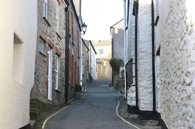 an alley way between two buildings in a city at Top Deck - Ancient Fishing Village - Near to the Beach! in Gorran Haven