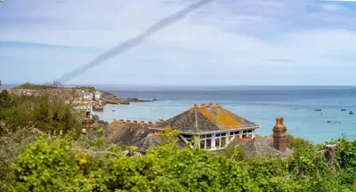 a house with a view of the ocean at Primrose Cottage in St Ives
