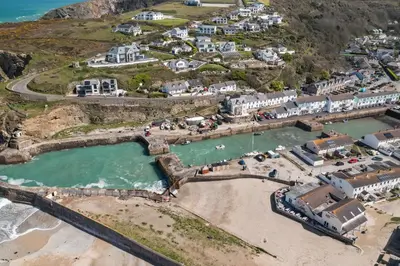 an aerial view of a beach with houses and buildings at Harbour Master's House in Portreath