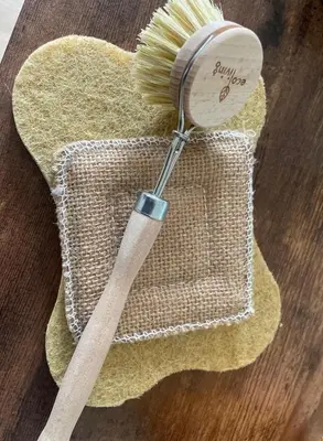 a broom and a brush sitting on a table at Blue Skies in St Ives