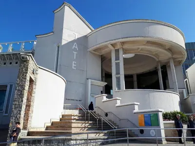 a building with people standing outside of it at Blue Skies in St Ives