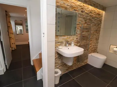 a bathroom with a sink and a toilet at Little Chygowlin in Truro