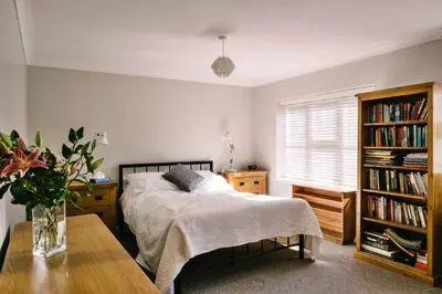 a bedroom with a bed and a book shelf at Finest Retreats - Charnwood in Lewannick
