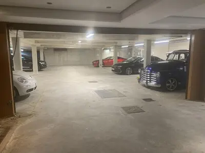 a garage with several cars parked in it at Ollies 4 Cribbar in Newquay