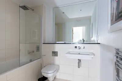 a bathroom with a toilet and a sink and a shower at Ollies 4 Cribbar in Newquay