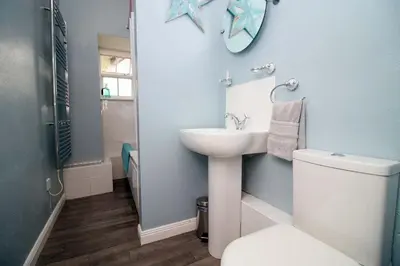 a bathroom with a sink and a toilet at The Cornish Nook Beautiful Grade 2 Listed Building In Cornwall By STAE-Homes in Camelford