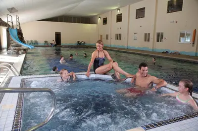 a group of people in a swimming pool at Blissful Escape Hengar Manor in Bodmin