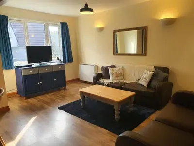 a living room with a couch and a coffee table at Blissful Escape Hengar Manor in Bodmin