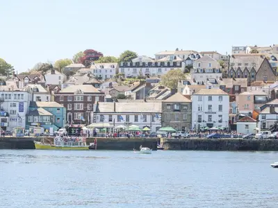 a view of a town from the water with boats at Owls Roost in Falmouth