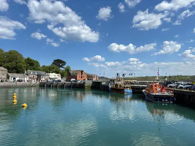 a group of boats docked in a river at Idyllic Cottage near Padstow in Little Petherick