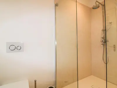a shower with a glass door in a bathroom at Crabs and Lobsters in Newquay