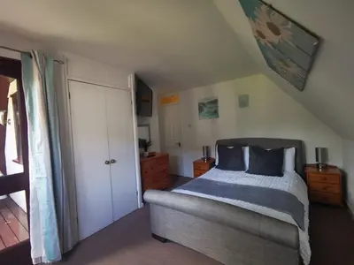 a bedroom with a bed and a dresser at 44 Trevithick view in Saint Erth