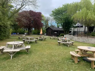 a group of picnic tables in a park at 44 Trevithick view in Saint Erth