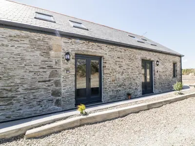 a brick building with windows on the side of it at The Cornstore in Bodmin