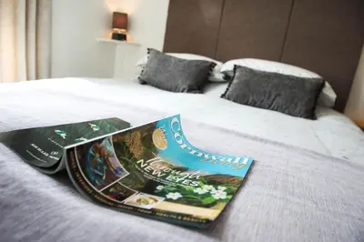 a book sitting on top of a bed at No 10 Treverbyn Road B & B in Padstow