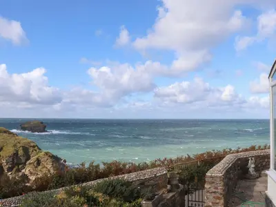 a view of the ocean from a house at Beach Cottage in Redruth