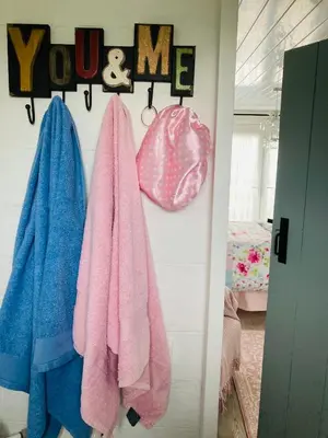a room with towels hanging on a wall at Shabby Shack near Charlestown & The Eden Project in St Austell