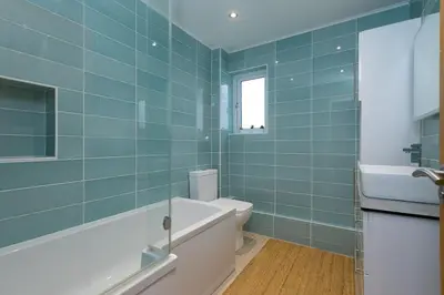 a bathroom with a toilet and a sink at Chi Lowen in Carbis Bay