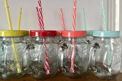 a group of mason jars with toothbrushes in them at Large 5 bed 3 bath house 300 meters from beach and restaurants in Newquay