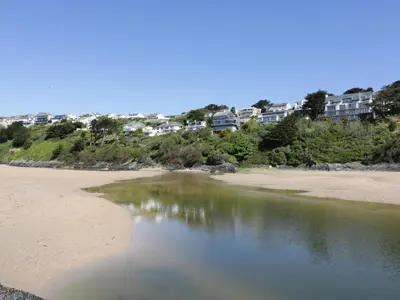 a view of a beach with buildings in the background at Estuary View in Newquay