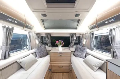 an interior of an rv with a couch and a table at Pinetum Gardens Retreats in St Austell