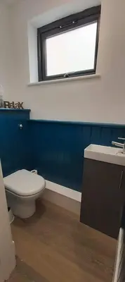 a bathroom with a white toilet and a window at Newquay Rialton Holiday Home in Newquay