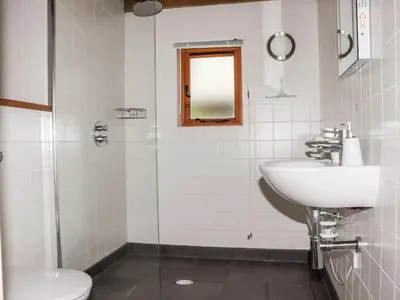 a bathroom with a sink and a toilet at Bybrook Lodge in Camelford