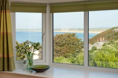 a window with a view of the ocean at Fairsky - Sea Views and Allocated Parking in Carbis Bay