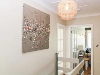 a living room with a painting on the wall at Ocean View in Torpoint