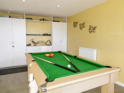 a room with a pool table with balls on it at Ocean View in Torpoint