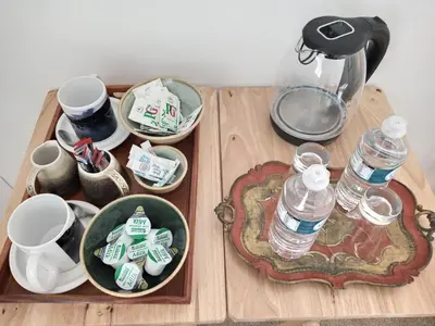 a table with cups and bottles of water on it at West Looe Downs in Looe