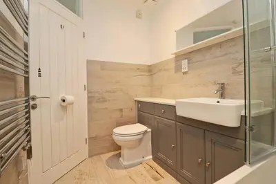 a bathroom with a toilet and a sink at Holiday home with Estuary Views, parking & balcony in Padstow