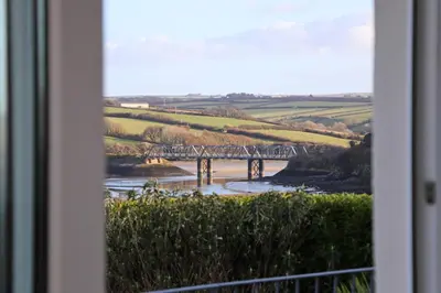 a view of a bridge from a window at Holiday home with Estuary Views, parking & balcony in Padstow
