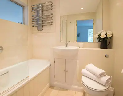 a bathroom with a toilet and a sink and a tub at Slipway 19 in Padstow