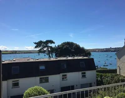 a building with a view of the water and boats at Slipway 10 in Padstow