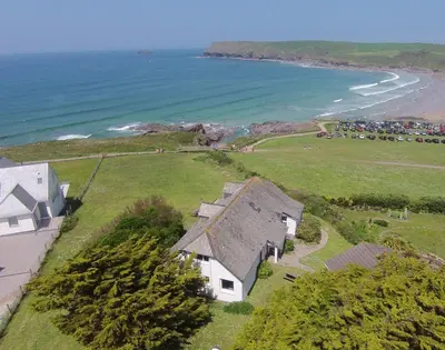 an aerial view of a house next to the ocean at Gullsway Sandpiper in Polzeath
