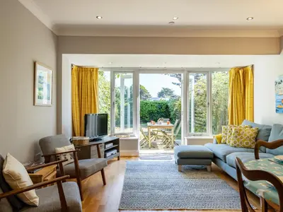 a living room with a couch and a tv at Lowenna Manor 4 in Padstow