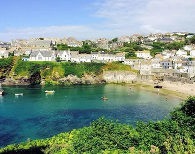 a body of water with a beach and houses at Folly 2 in Port Isaac