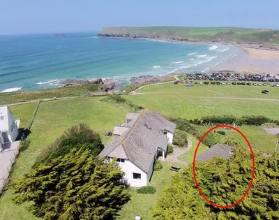 an aerial view of a house next to the beach at Gullsway September Tide in Polzeath