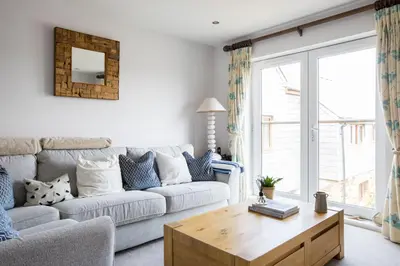 a living room with a couch and a coffee table at Rock Lobster in Port Isaac