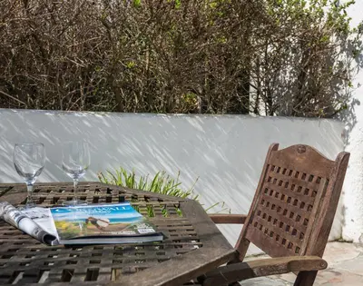a picnic table with a book and a book at Signal Post in Port Isaac