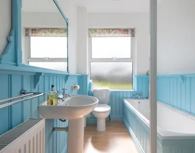 a bathroom with a sink and a tub and a toilet at Signal Post in Port Isaac