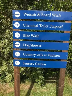 a blue sign with the names of different walks at 1.2 padstow in Padstow