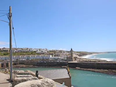 a view of a city and the ocean with buildings at The Dairy in Helston