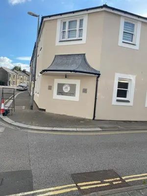 a building on the side of a street at Apartment No 8 - Stay in style in the heart of the Cathedral City. in Truro