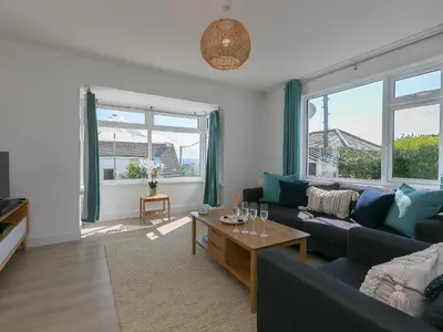 a living room with a couch and a table at Brynmaur in St Ives