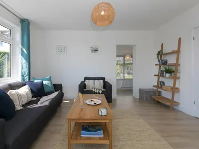 a living room with a couch and a coffee table at Brynmaur in St Ives