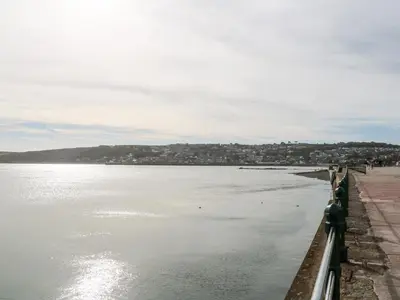 a view of a body of water with a city at The Cottage in Penzance